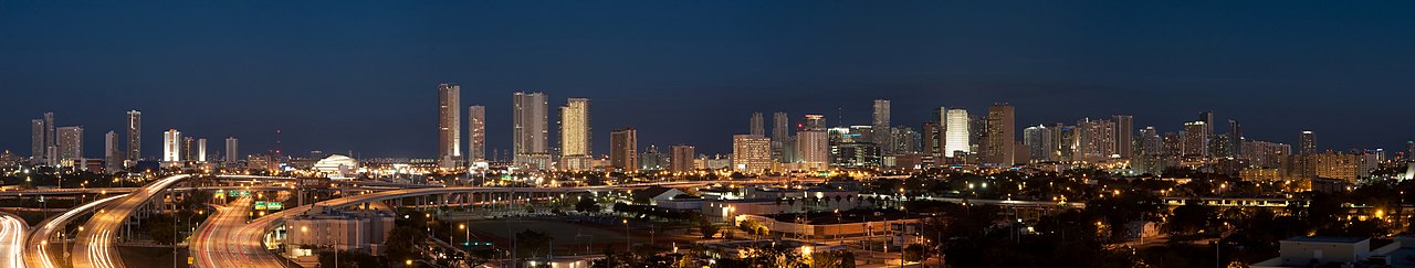 Miami skyline with office towers reflected in Biscayne Bay at sunset