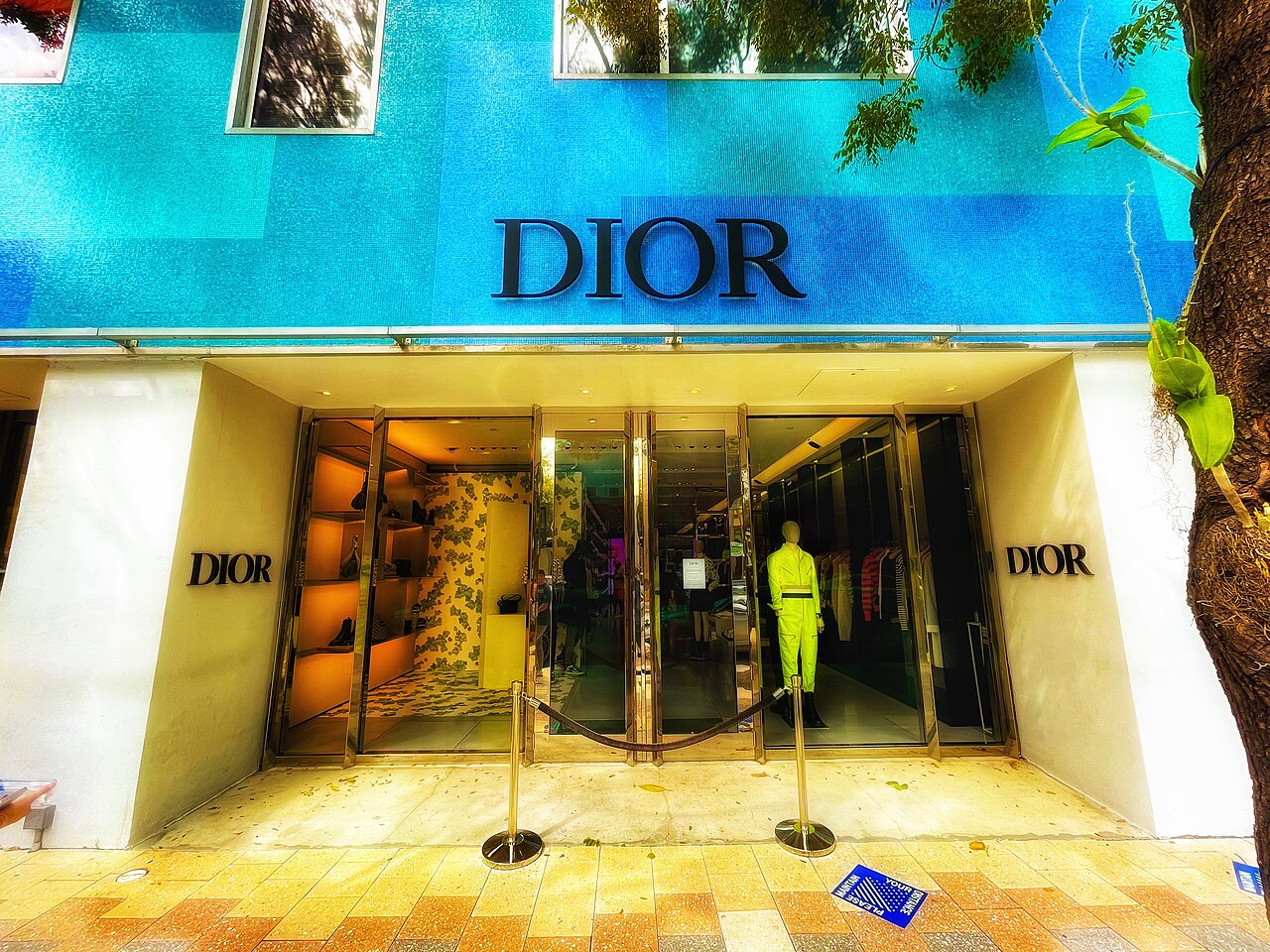 Wide street view of Miami Design District with high-end boutiques and modern architecture under a bright sky